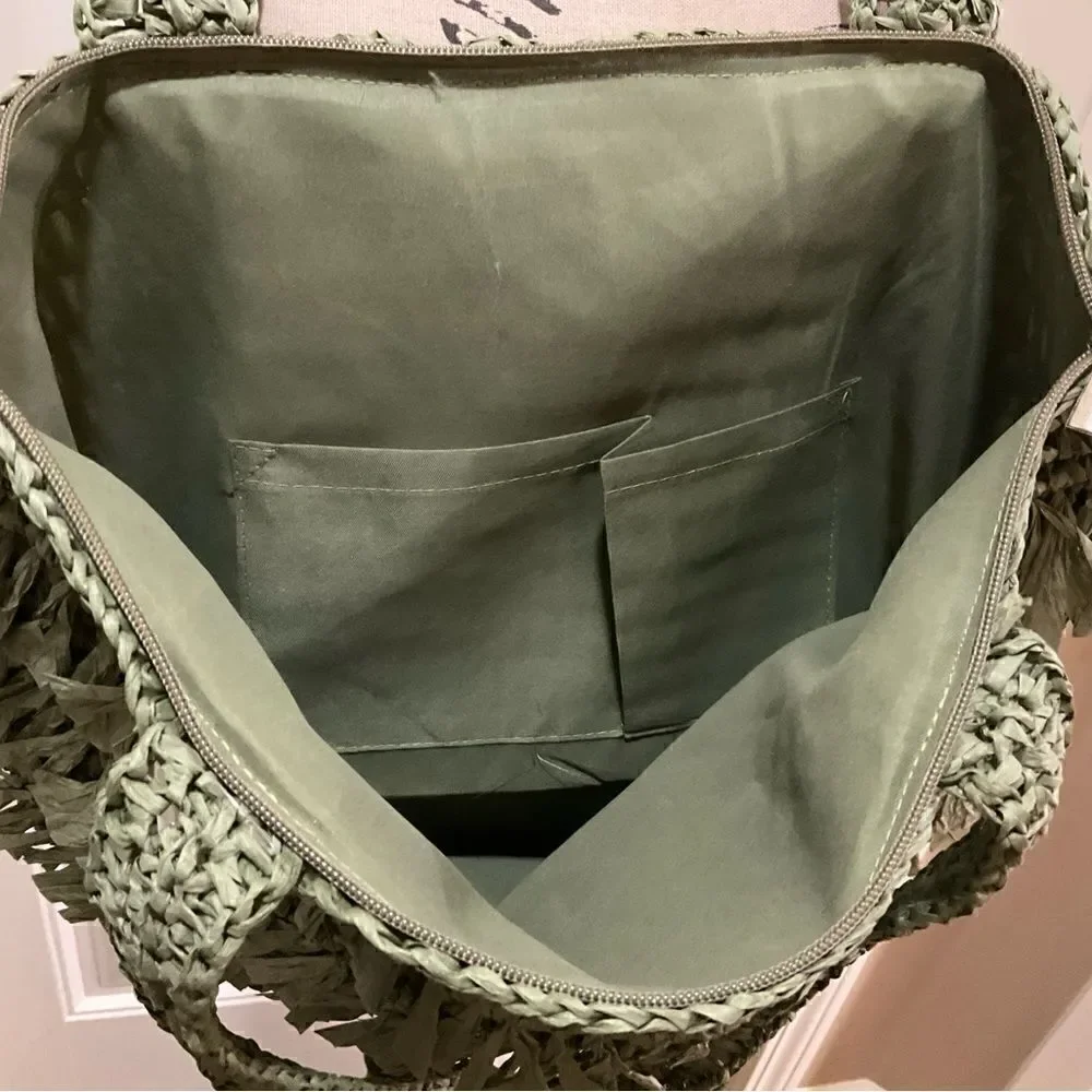 The Last Straw Fringe Straw Tote Bag. In Olive